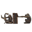 A pair of dark brown monkey bookends holding a set of three vintage-style books, photographed against a solid white background.