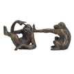 A pair of bronze-finished monkey sculptures depicting two playful primates on a plain white background.