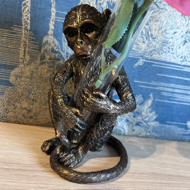 Bronze Monkey holding a Vase
