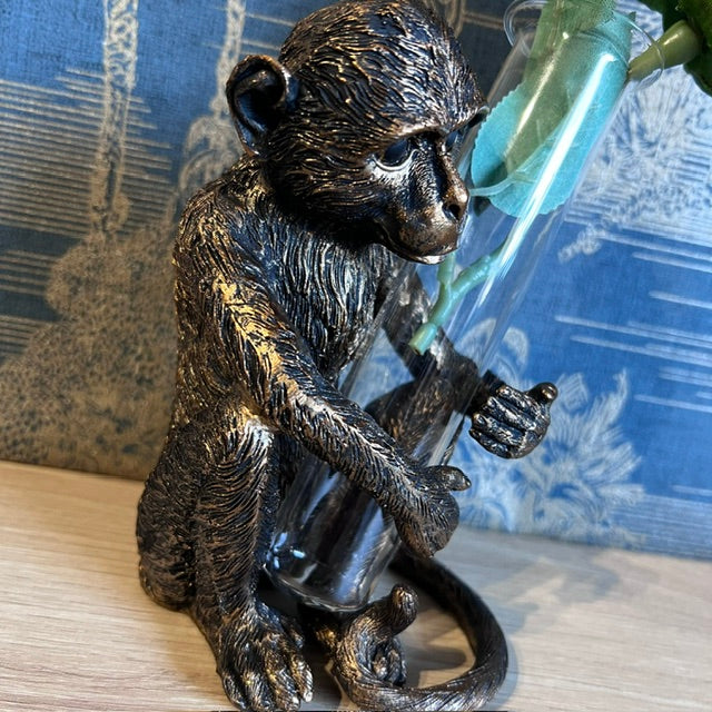 Bronze Monkey holding a Vase