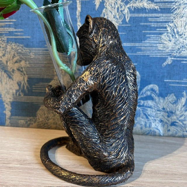 Bronze Monkey holding a Vase