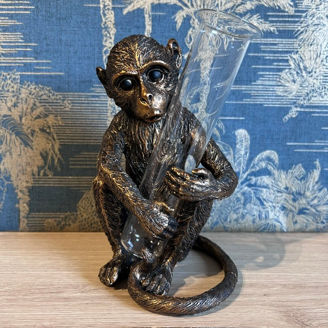 Bronze Monkey holding a Vase