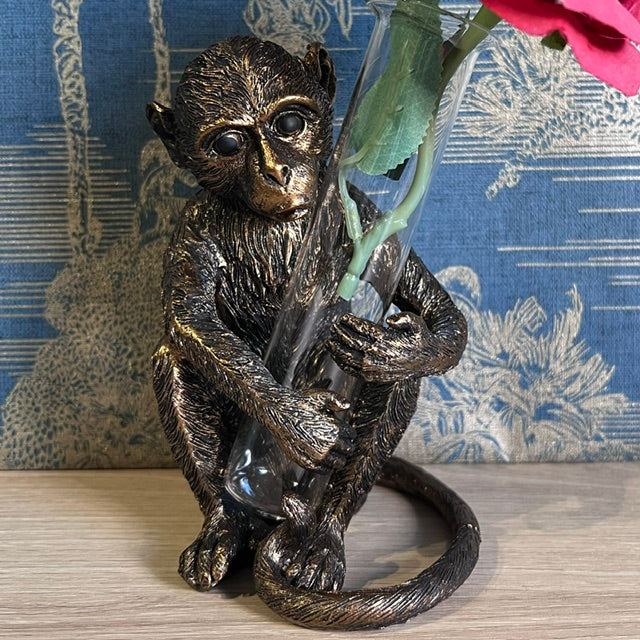 Bronze Monkey holding a Vase