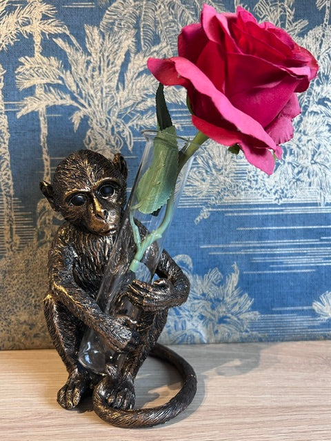 Bronze Monkey holding a Vase