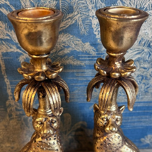 Close-up of the taper candle cups and palm-inspired detailing