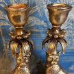 Close-up of the taper candle cups and palm-inspired detailing